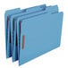 A group of blue Smead letter size fastener folders with brown labels.