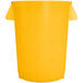 A yellow plastic Carlisle Bronco trash can with a lid.