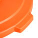 An orange plastic lid for a Carlisle Bronco trash can.