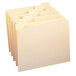 A stack of Smead file folders with reinforced tabs.