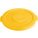 A yellow Carlisle plastic lid for a round trash can with a handle.