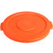 An orange plastic lid with a small circle.