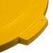 A yellow plastic Carlisle Bronco lid with a plastic handle.