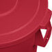 A red plastic lid for a Carlisle Bronco trash can.