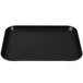 A black rectangular Cambro Camlite tray on a counter.