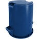 A blue Carlisle round plastic trash can with a lid.