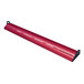 A red metal curved display light with holes in a long red tube.