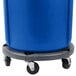 A blue Rubbermaid BRUTE recycling cart with wheels and a handle.