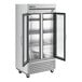 A True 2 section glass door reach-in refrigerator with white background.