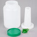 A white plastic container with a green spout and cap.