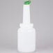 A white bottle with a green spout and cap.