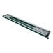 A long green and silver Hatco curved display light on a table.