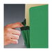 A hand opening a green Smead file pocket.