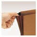 A hand opening a redrope Smead expansion wallet.
