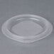 A clear plastic Fabri-Kal side dish container with a vented lid.