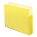 A yellow file folder with white paper inside.