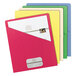 A stack of Smead Organized Up slash-style file jackets in assorted colors with white papers inside.