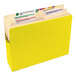 A yellow Smead file folder with tabs and labels.