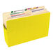 A yellow Smead legal size file pocket with a label and tabs.