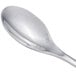 A close-up of a Chef & Sommelier stainless steel spoon with a silver handle.