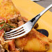 A Chef & Sommelier stainless steel dinner fork on a plate of pasta.