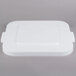A white square Rubbermaid lid with black handles.