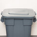 A gray trash can with a lid on top.
