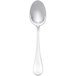 A silver spoon with a white handle.