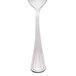 A Libbey stainless steel teaspoon with a white handle.