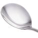 A close-up of a Libbey stainless steel bouillon spoon with a silver handle.