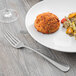 A plate of food with a Libbey stainless steel European dinner fork.
