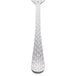 The handle of a Libbey stainless steel dinner fork with a white background.