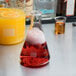 An American Metalcraft glass Erlenmeyer beaker filled with red and yellow liquid.