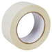 A close-up of a roll of Duck Tape clear carpet tape with a circle.