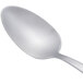 An Arcoroc stainless steel teaspoon with a silver handle.