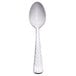 A Libbey stainless steel demitasse spoon with a white handle and silver spoon.