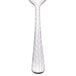 A Libbey stainless steel demitasse spoon with a textured handle.