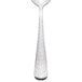 A Libbey stainless steel teaspoon with a textured pattern on the handle.