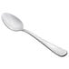 A Libbey stainless steel teaspoon with a silver handle on a white background.