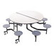 A National Public Seating round cafeteria table with stools underneath.