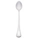 A Libbey stainless steel iced tea spoon with a white handle and silver spoon.