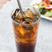 A Libbey stainless steel iced tea spoon in a glass of iced tea.