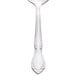 A Libbey stainless steel bouillon spoon with a silver handle.