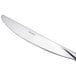 An Arcoroc stainless steel dinner knife with a silver handle.