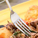 An Arcoroc stainless steel dinner fork on a plate of pasta.