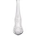 A Libbey stainless steel dessert spoon with a decorative design on the handle.