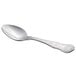 A close-up of a Libbey stainless steel dessert spoon with a handle.