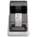 A Seiko Instruments Smart Label Printer 620 printing a white label.