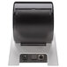 A close-up of a black and white Seiko Instruments Smart Label Printer 620 with a USB cable attached.