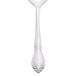 A Libbey stainless steel dessert spoon with a design on the handle.